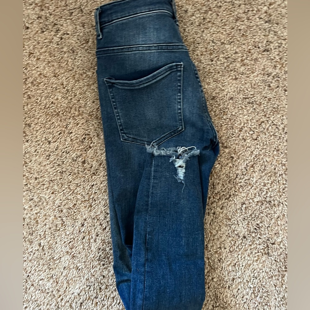 High rise skinny jeans with holes.